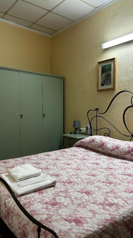 Postel nebo postele na pokoji v ubytování Albergo Fiorita