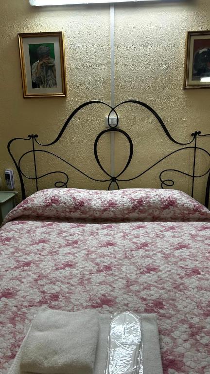 Postel nebo postele na pokoji v ubytování Albergo Fiorita