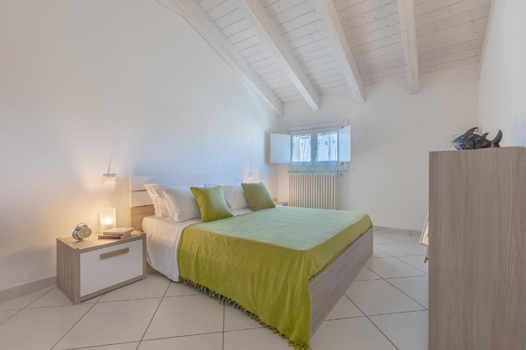 Postel nebo postele na pokoji v ubytování La Piccola Venezia Apartment