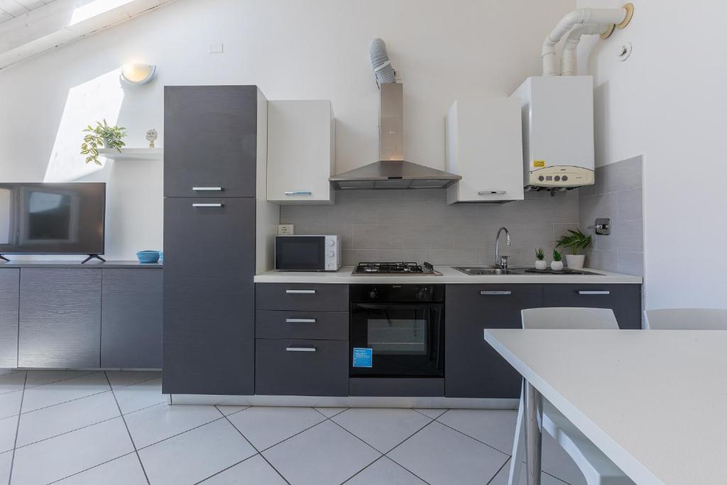 Kuchyň nebo kuchyňský kout v ubytování La Piccola Venezia Apartment