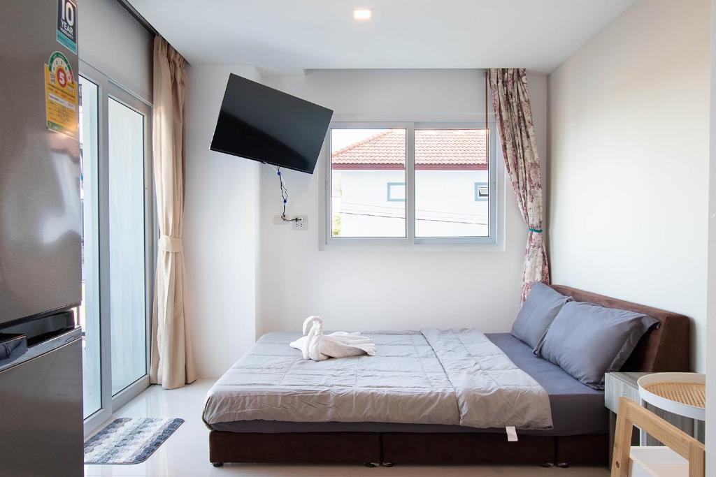Ένα ή περισσότερα κρεβάτια σε δωμάτιο στο Mantra Beach condominium M229