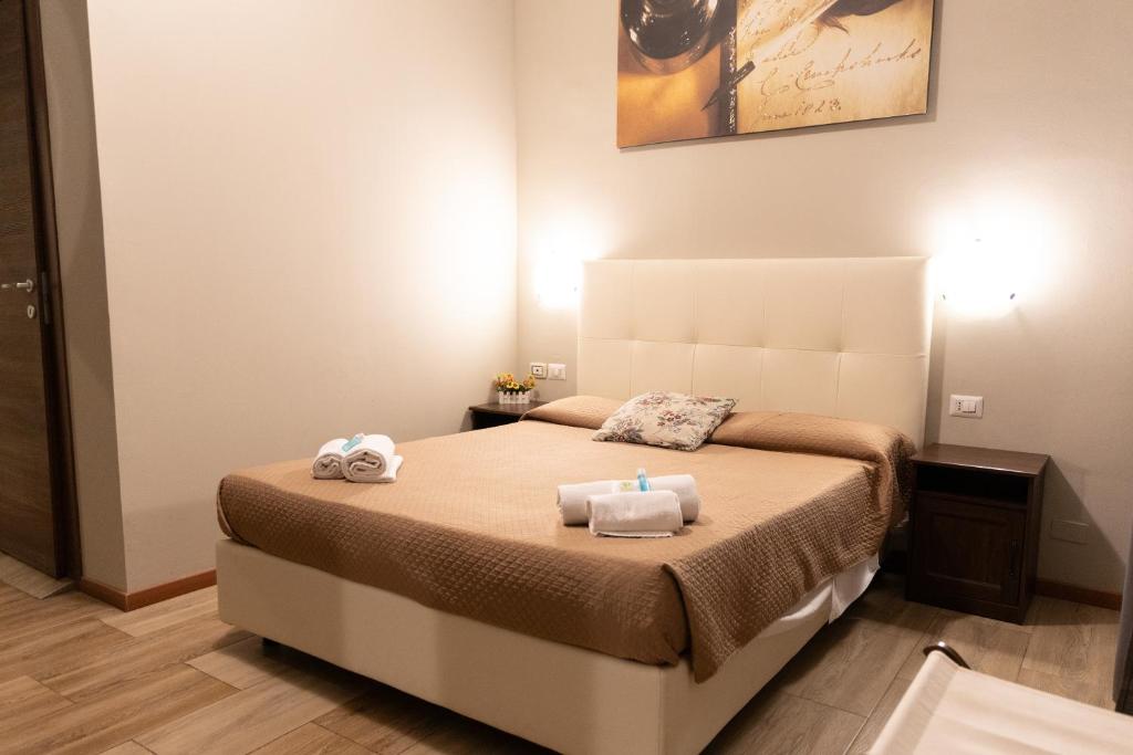 Posteľ alebo postele v izbe v ubytovaní Golden Milano Hotel