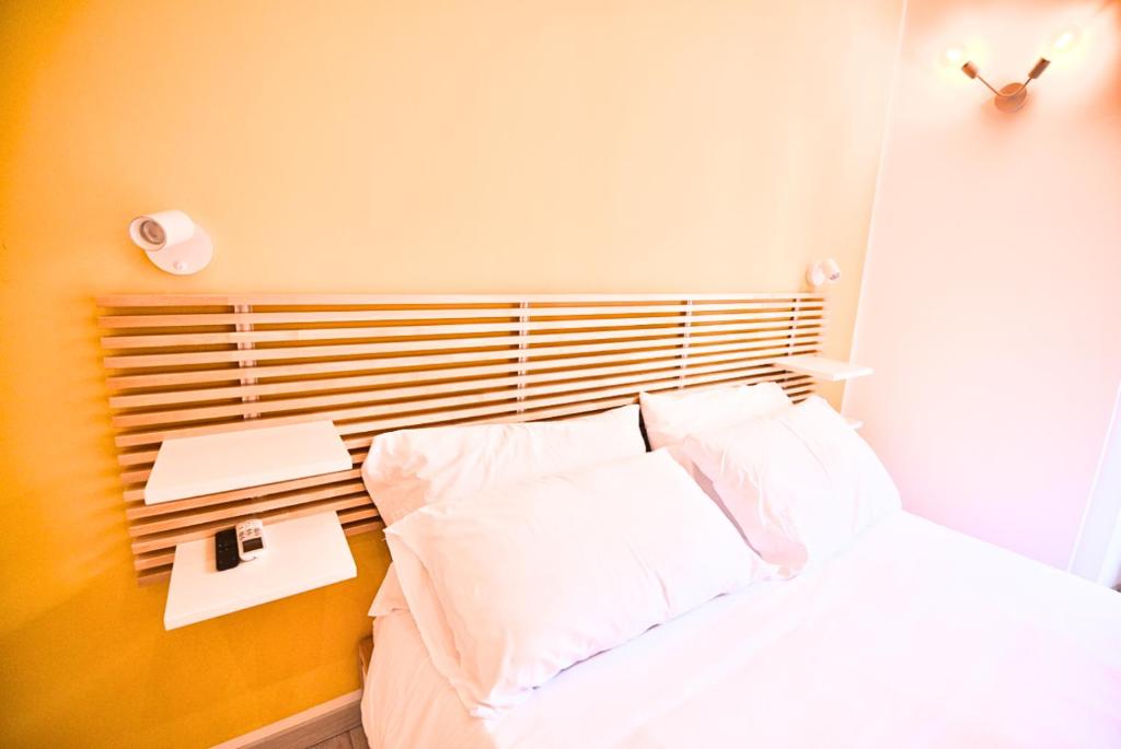 Postel nebo postele na pokoji v ubytování Tigullio Suites Rapallo