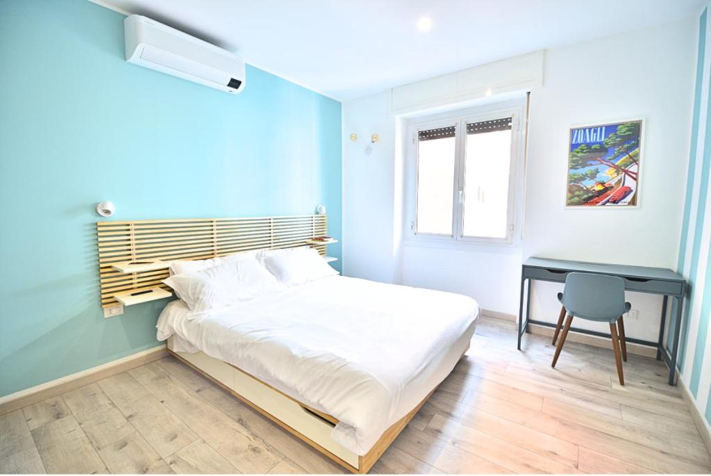 Postel nebo postele na pokoji v ubytování Tigullio Suites Rapallo