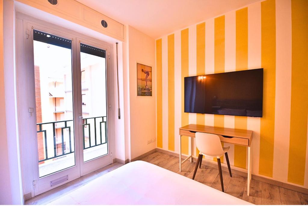 TV a/nebo společenská místnost v ubytování Tigullio Suites Rapallo