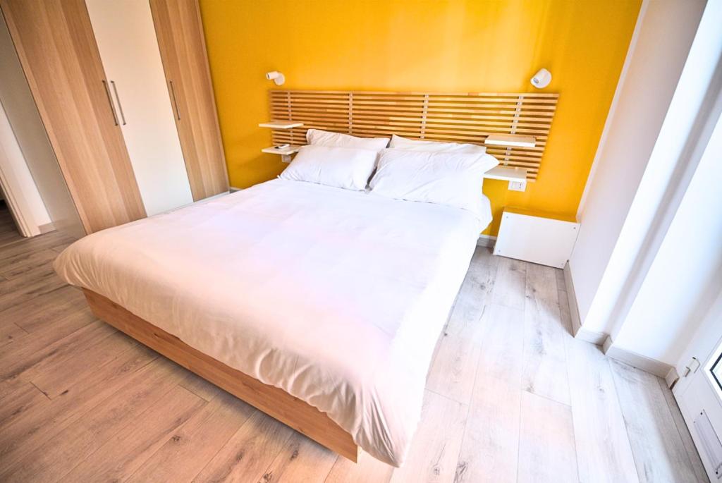 Postel nebo postele na pokoji v ubytování Tigullio Suites Rapallo