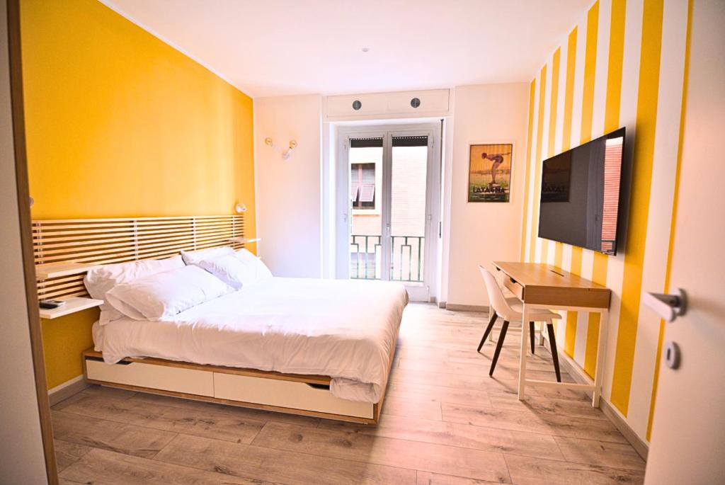 Postel nebo postele na pokoji v ubytování Tigullio Suites Rapallo