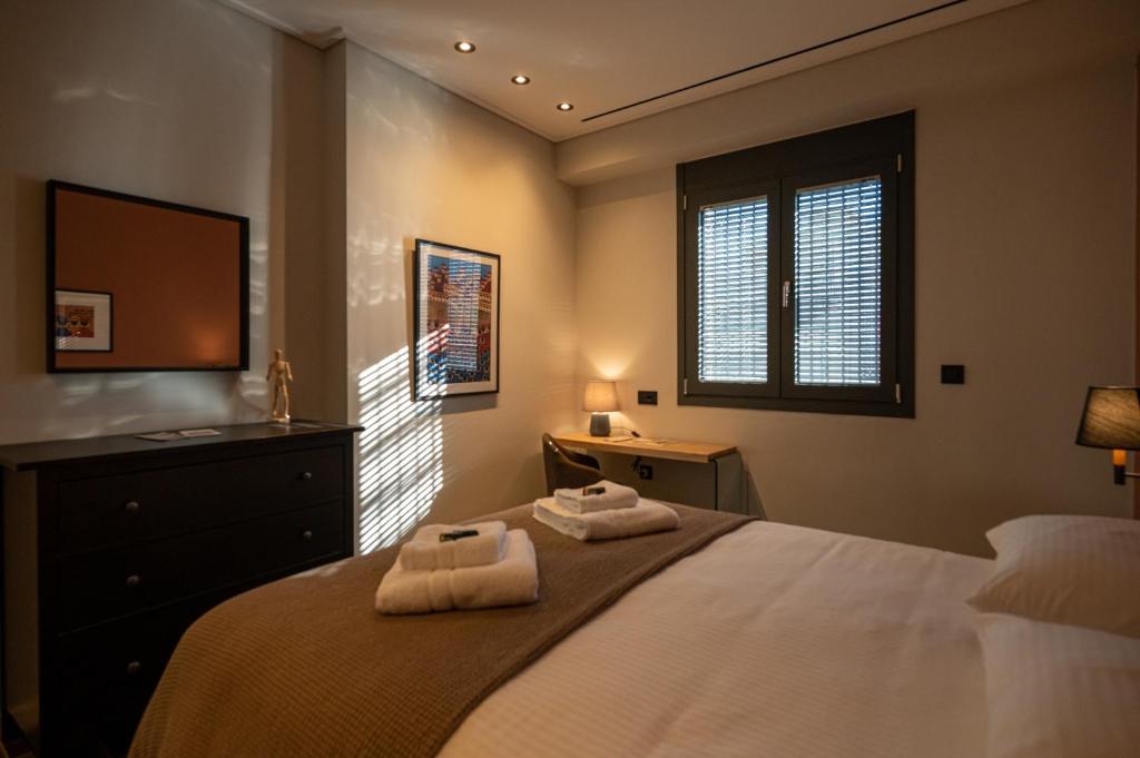 Giường trong phòng chung tại Grande Villa Vesta - Kalamata Mediterranean Villas