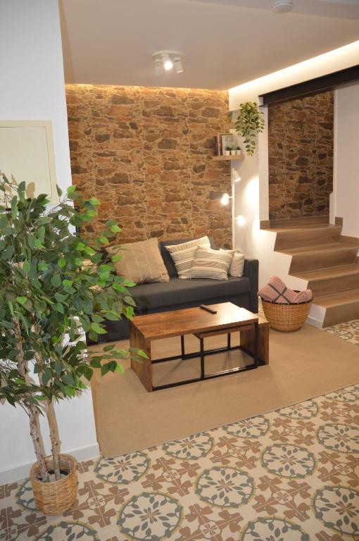 a living room with a couch and a table at Tras Do Atrio Casa en el Centro de Betanzos in Betanzos