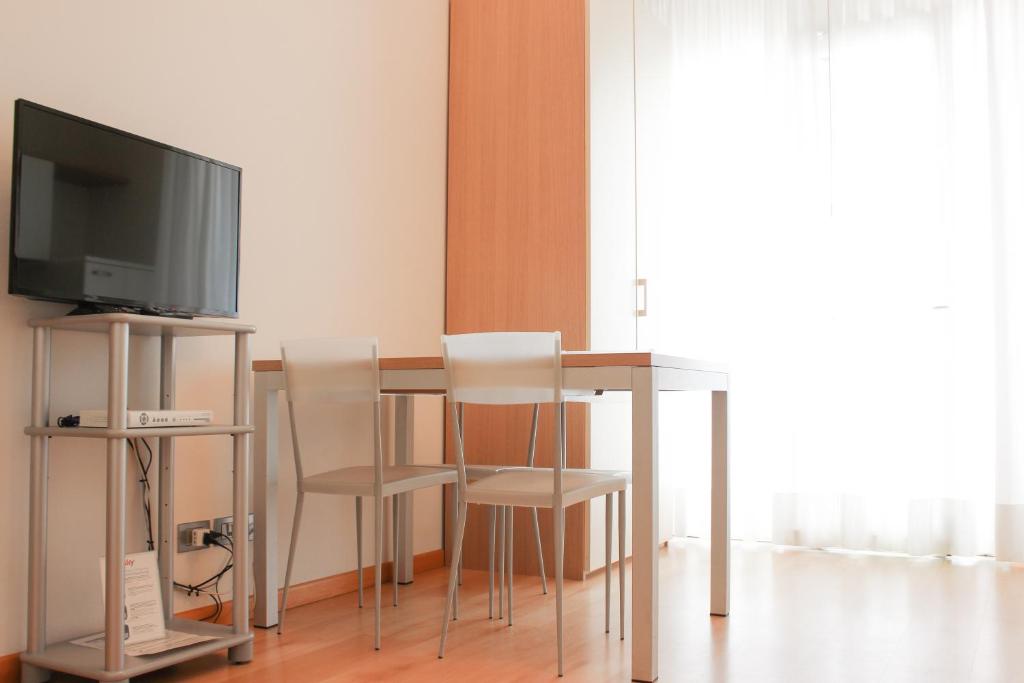 TV a/nebo společenská místnost v ubytování Aparthotel Royal