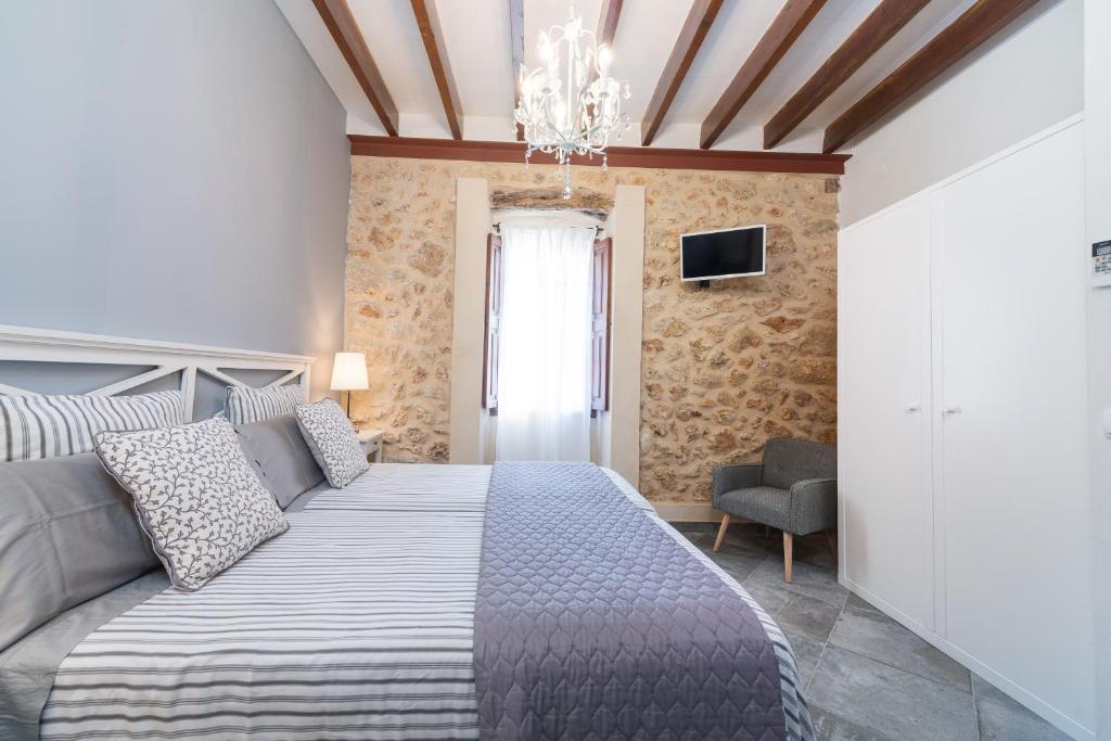 A bed or beds in a room at Can Jaume Fuster