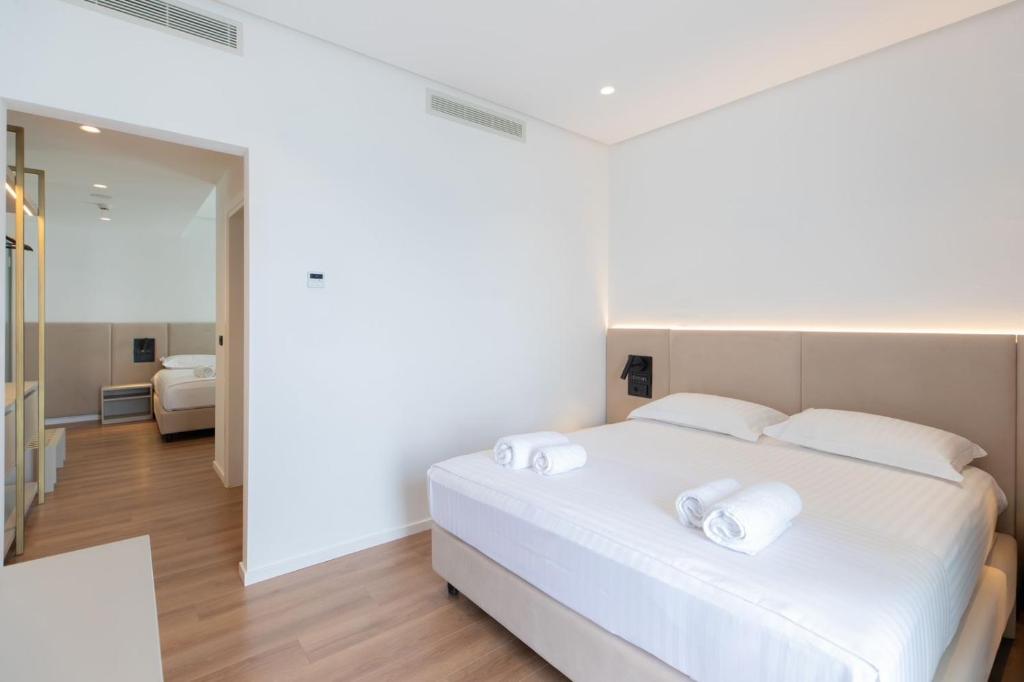 Postel nebo postele na pokoji v ubytování Morina Beach Hotel
