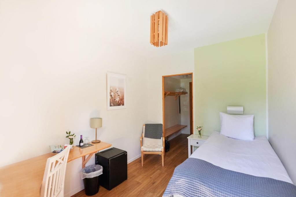 Postel nebo postele na pokoji v ubytování Mullsjö Hotell & Konferens