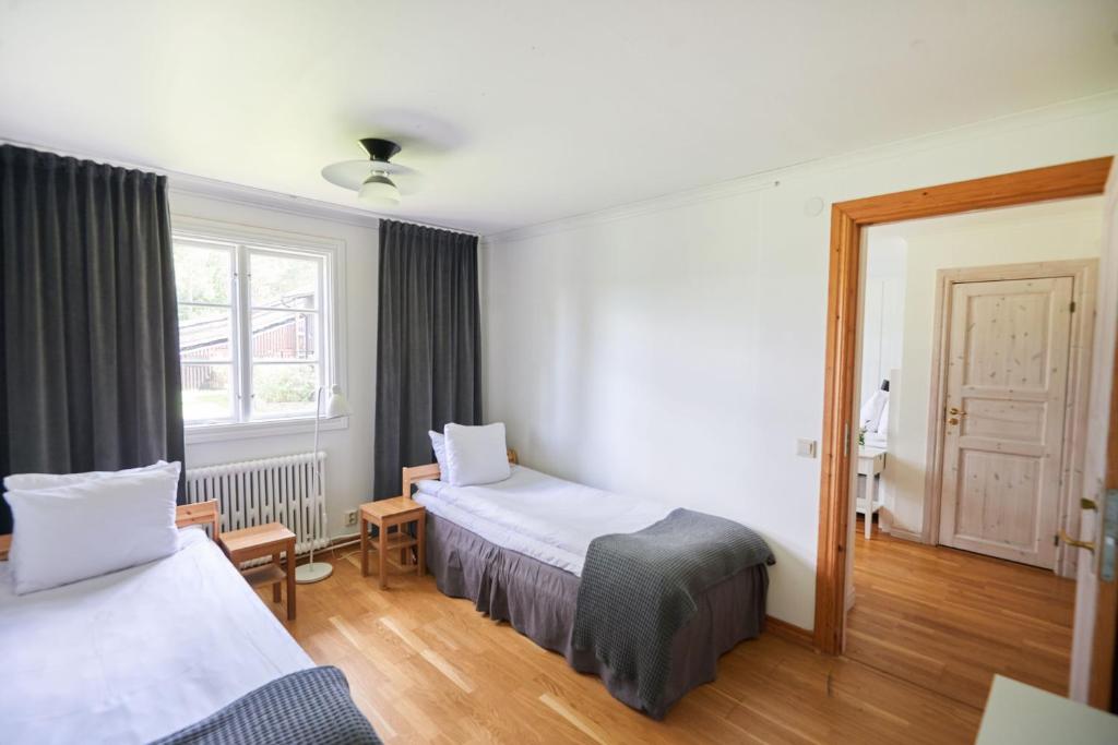 Postel nebo postele na pokoji v ubytování Mullsjö Hotell & Konferens