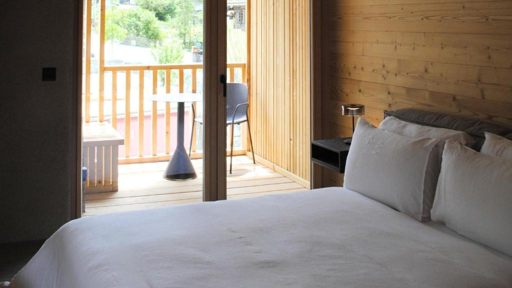 Postel nebo postele na pokoji v ubytování Boutique Hotel Casa Giovanoli