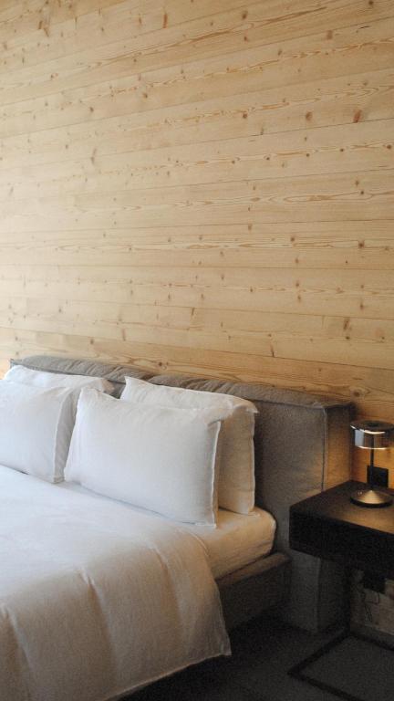 Postel nebo postele na pokoji v ubytování Boutique Hotel Casa Giovanoli