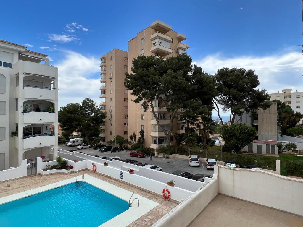 a swimming pool on the balcony of a building at Puerto Marina in Benalmádena