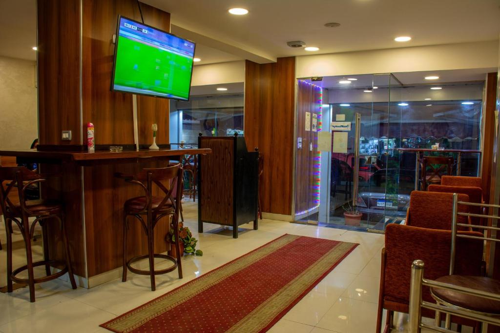TV a/nebo společenská místnost v ubytování Amoun Hotel Alexandria