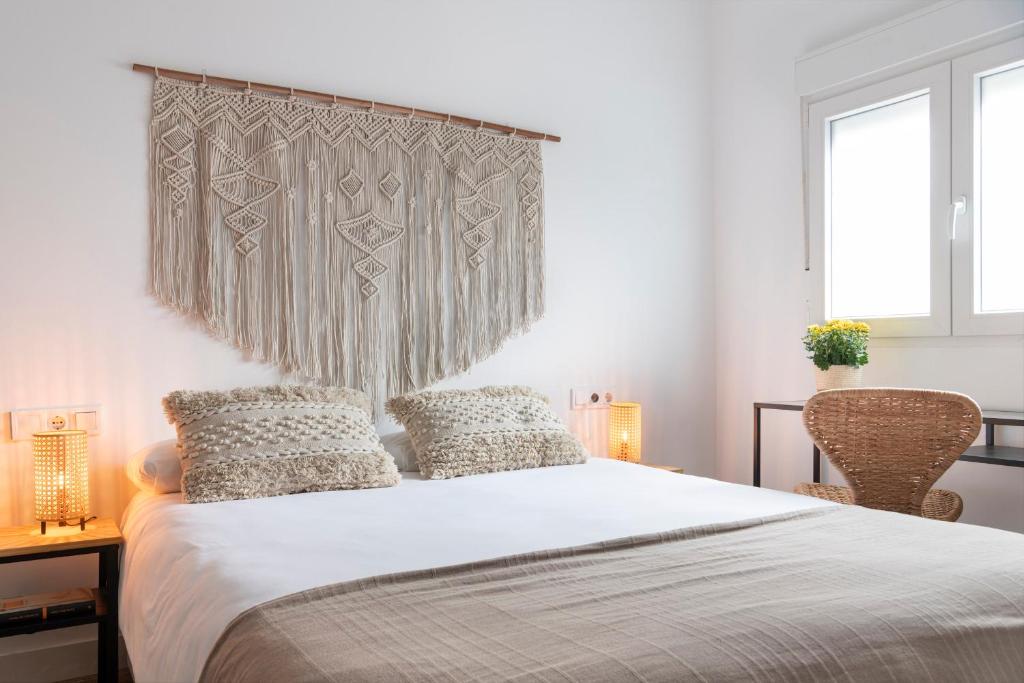 Ένα ή περισσότερα κρεβάτια σε δωμάτιο στο Calma Muralla House-Two bedrooms & two bathrooms