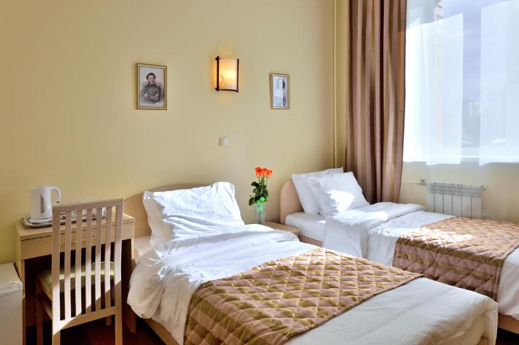 เตียงในห้องที่ Mini-Hotel Pushkin