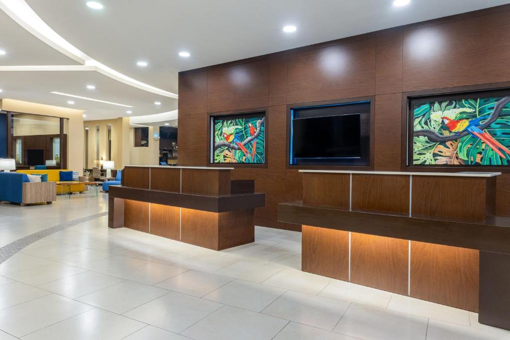 a lobby of a hospital with stained glass windows at Courtyard by Marriott San Jose Airport Alajuela in Alajuela City