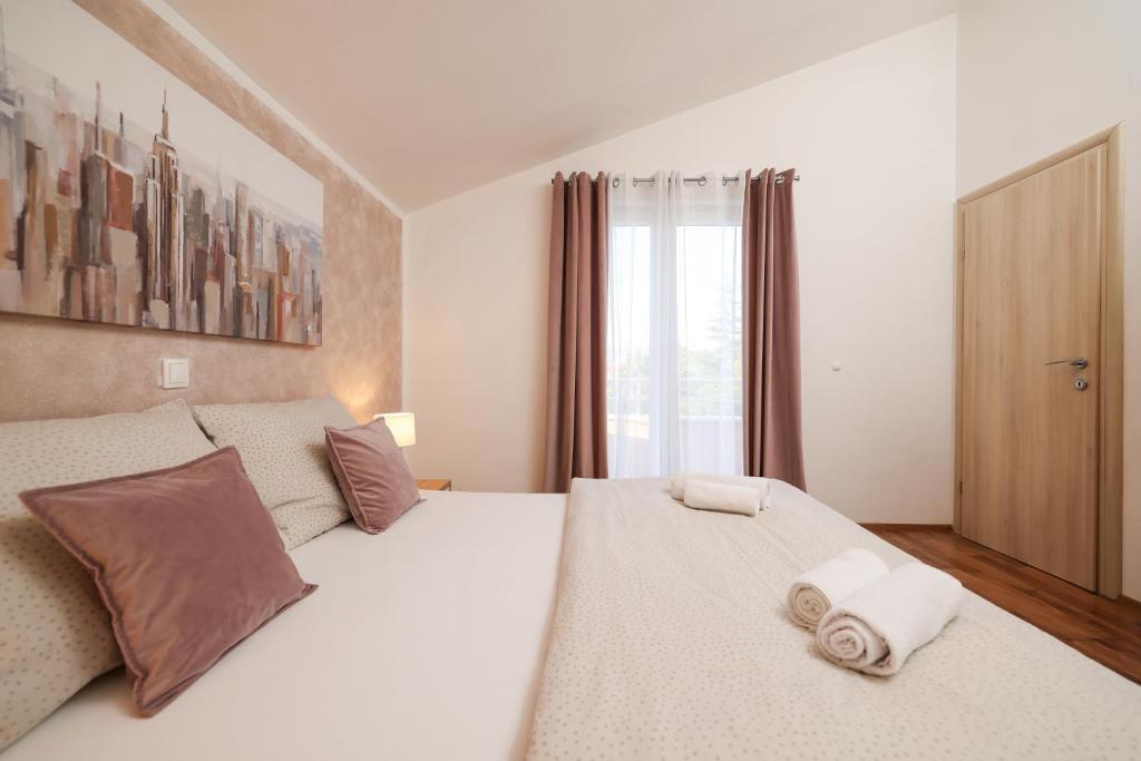 Postel nebo postele na pokoji v ubytování Apartments Anita