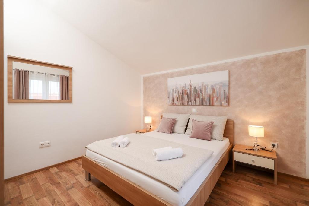 Postel nebo postele na pokoji v ubytování Apartments Anita