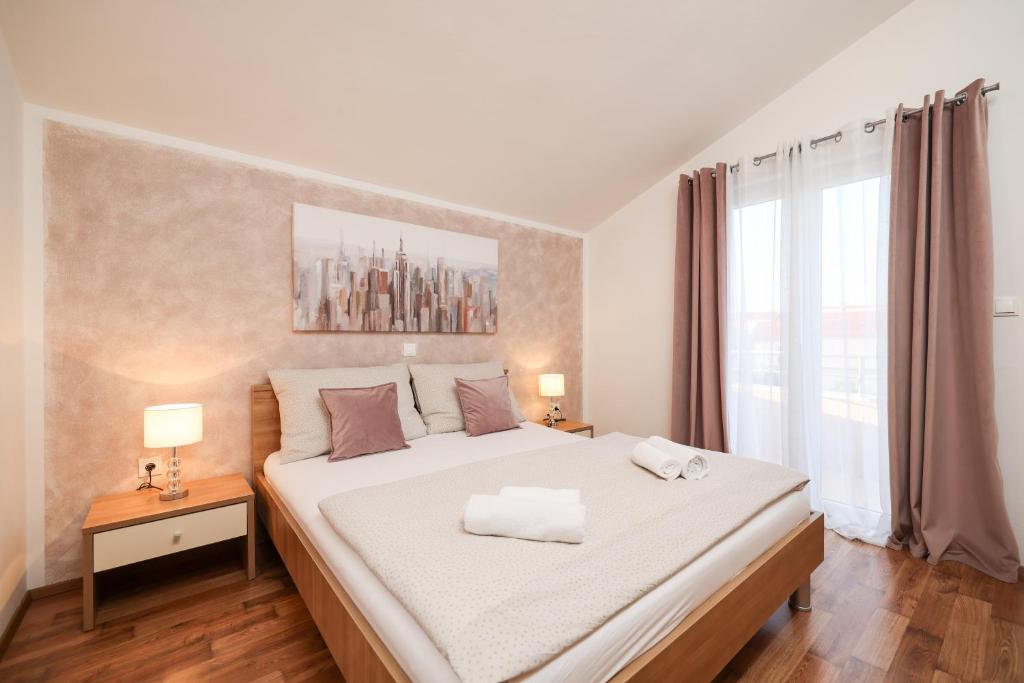 Postel nebo postele na pokoji v ubytování Apartments Anita
