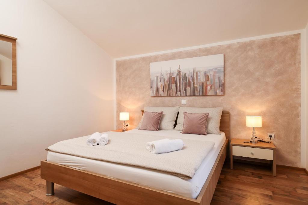 Postel nebo postele na pokoji v ubytování Apartments Anita