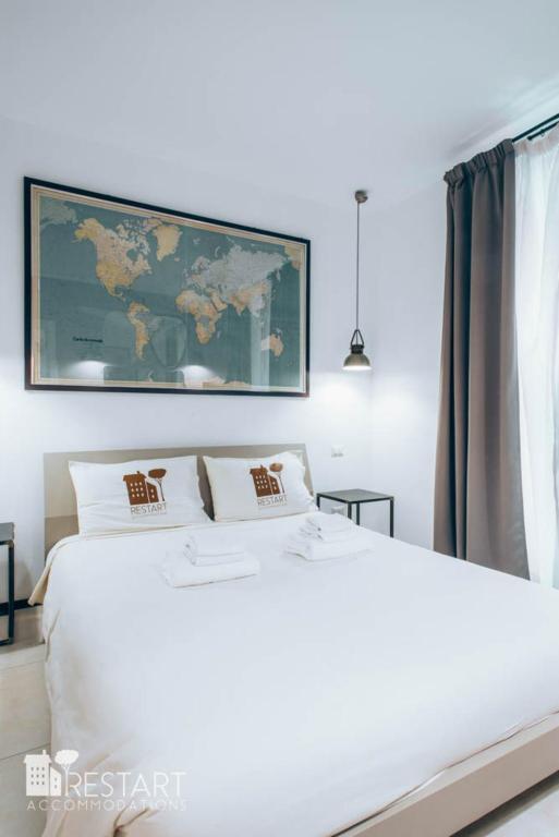 Posteľ alebo postele v izbe v ubytovaní Restart Accommodations Aldobrandini e Sciarra