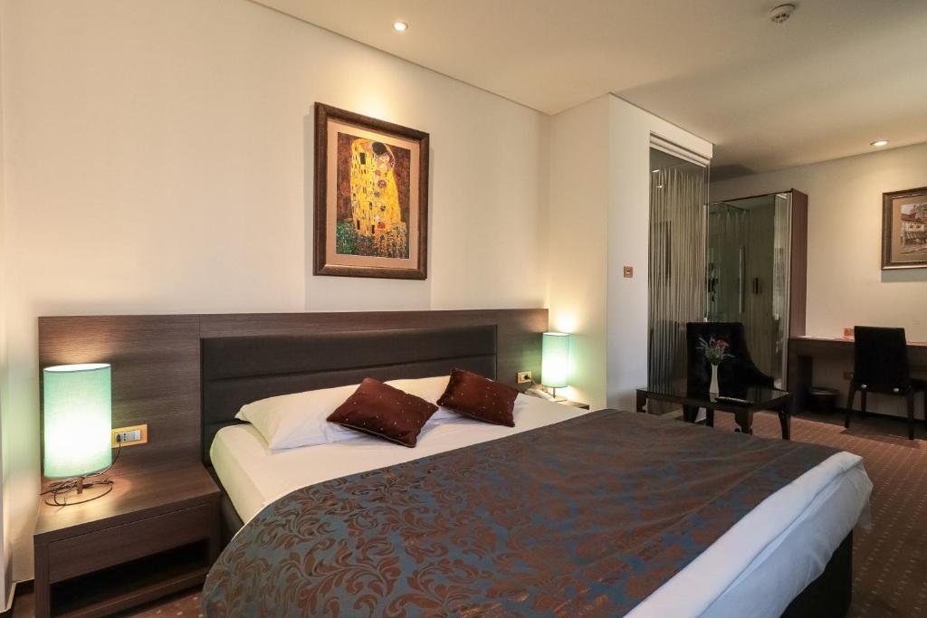 Postel nebo postele na pokoji v ubytování Hotel Nartel