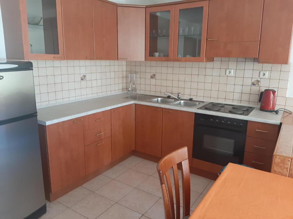 Kuchyň nebo kuchyňský kout v ubytování Apartments Kalsan