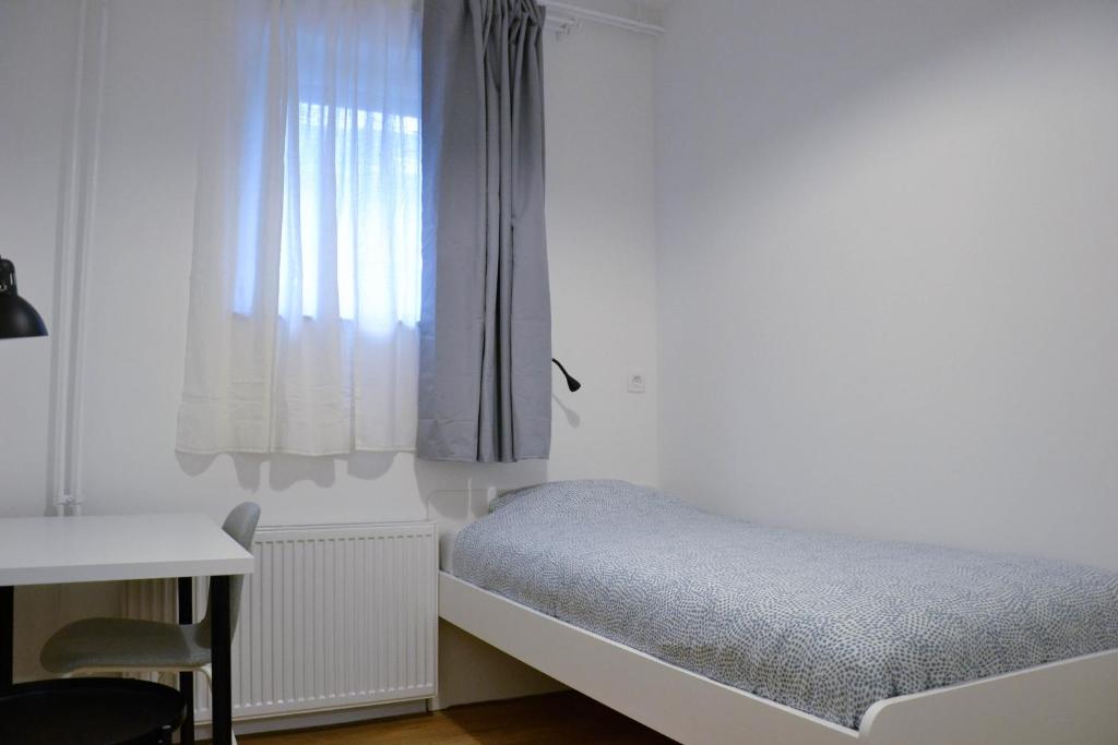Postel nebo postele na pokoji v ubytování Tesla house