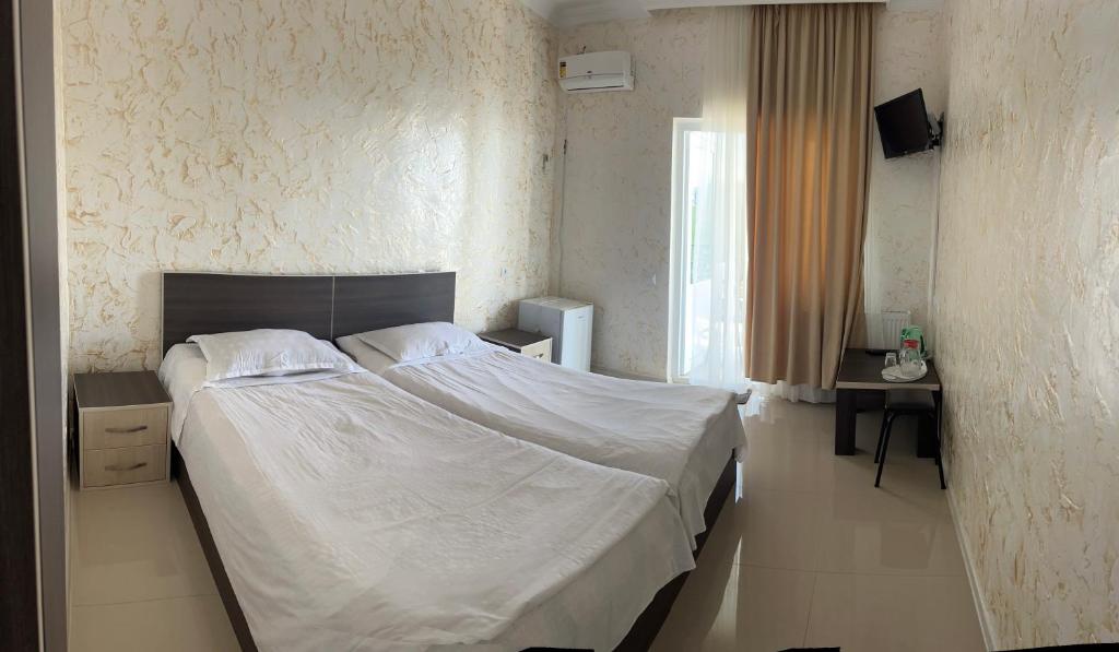 Postel nebo postele na pokoji v ubytování Inn David