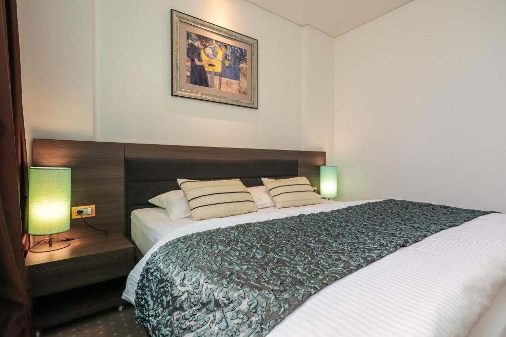 Postel nebo postele na pokoji v ubytování Hotel Nartel
