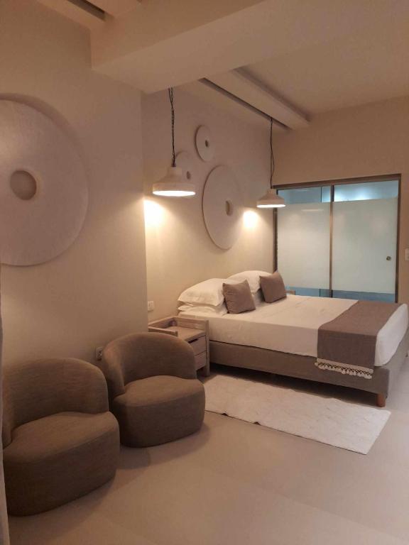 Postel nebo postele na pokoji v ubytování Sea Nymphs Suites