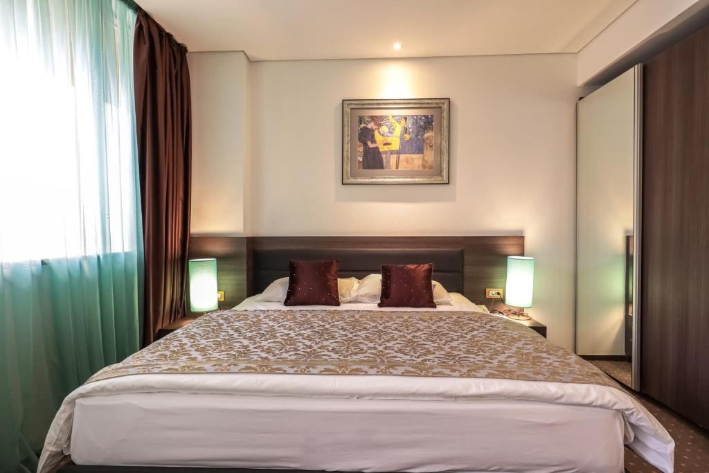Postel nebo postele na pokoji v ubytování Hotel Nartel
