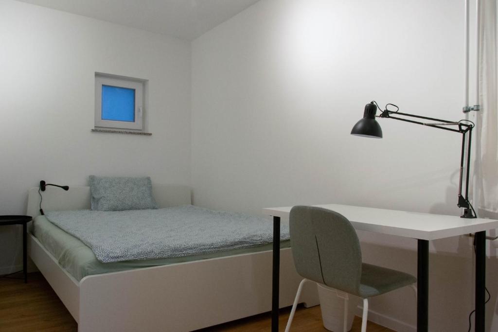 Postel nebo postele na pokoji v ubytování Tesla house