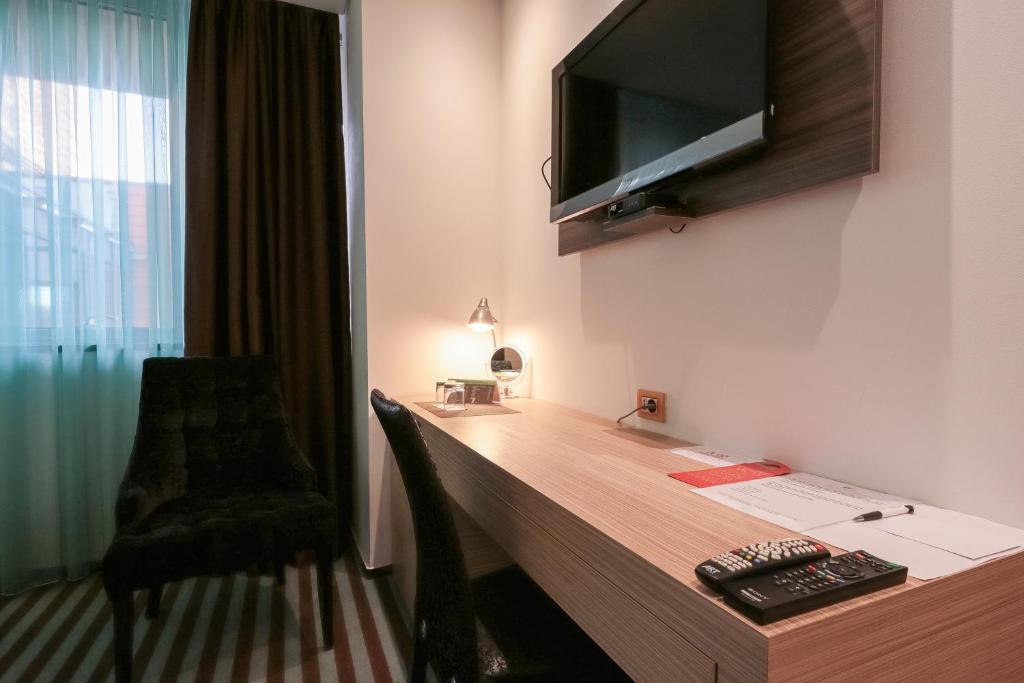 TV a/nebo společenská místnost v ubytování Hotel Nartel