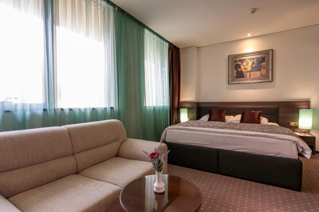 Postel nebo postele na pokoji v ubytování Hotel Nartel
