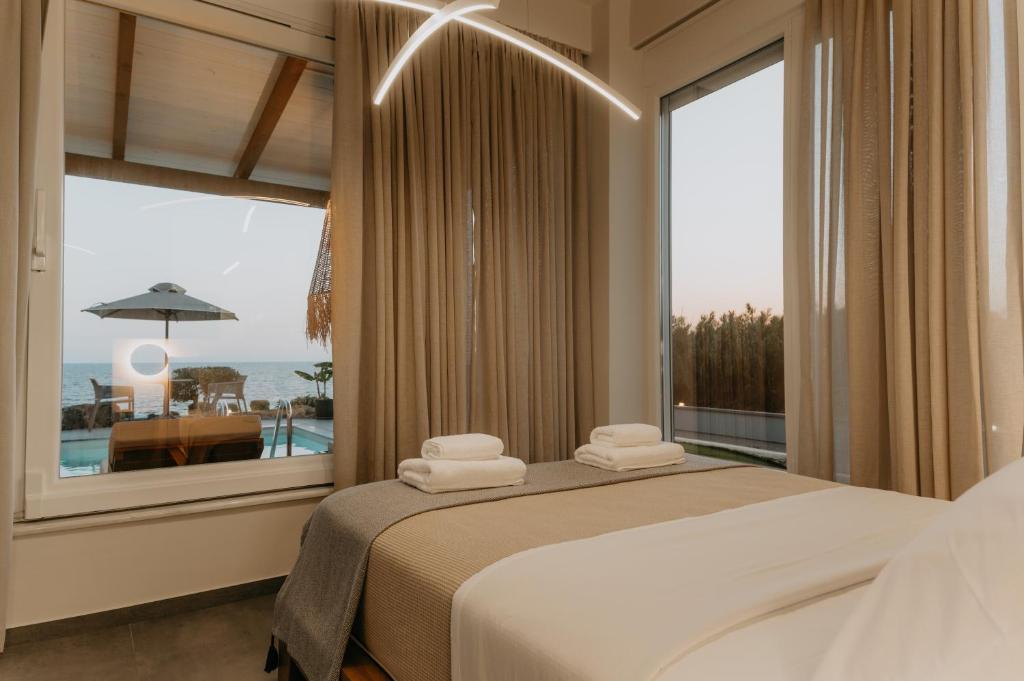 Postel nebo postele na pokoji v ubytování ALS COMFORT SUITES