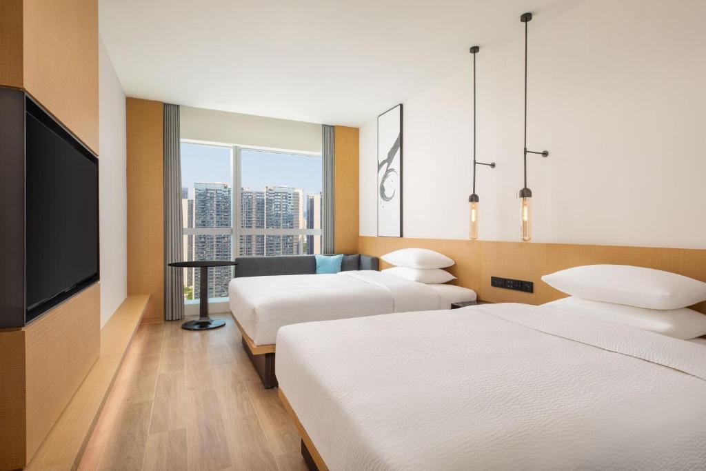 Postel nebo postele na pokoji v ubytování Fairfield by Marriott Shenzhen Bao'an