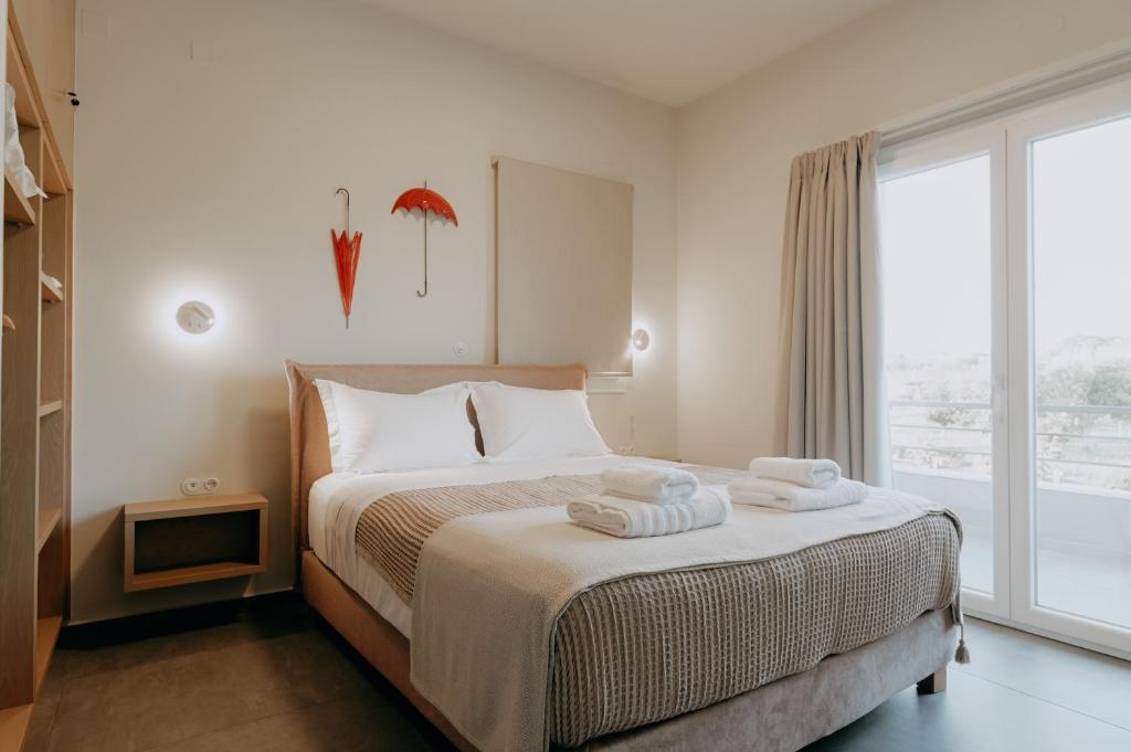 Postel nebo postele na pokoji v ubytování ALS COMFORT SUITES