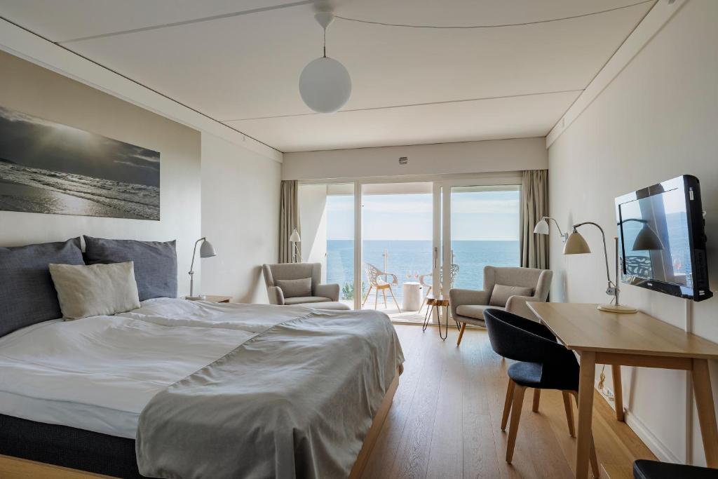Postel nebo postele na pokoji v ubytování Fredensborg Badehotel