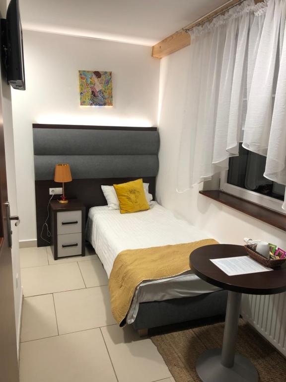 Posteľ alebo postele v izbe v ubytovaní Apartamenty Wakacyjna Wioska Ngô 20m od Suntago
