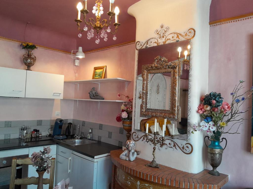 Kuchyň nebo kuchyňský kout v ubytování Studio Magenta