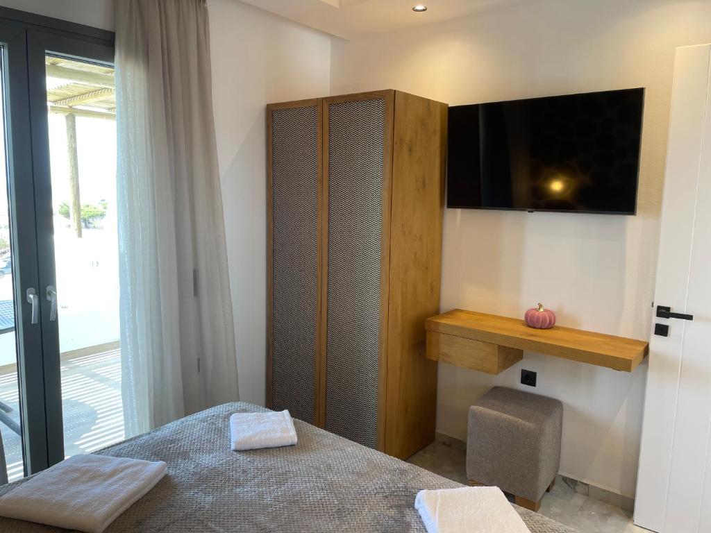 Postel nebo postele na pokoji v ubytování Latramys Suites