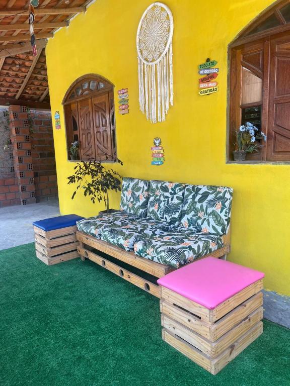 a couch sitting in the corner of a house at Canto da Gaivota Lençóis Maranhenses in Santo Amaro