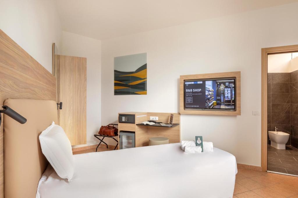 TV a/nebo společenská místnost v ubytování B&B Hotel Pomezia Roma