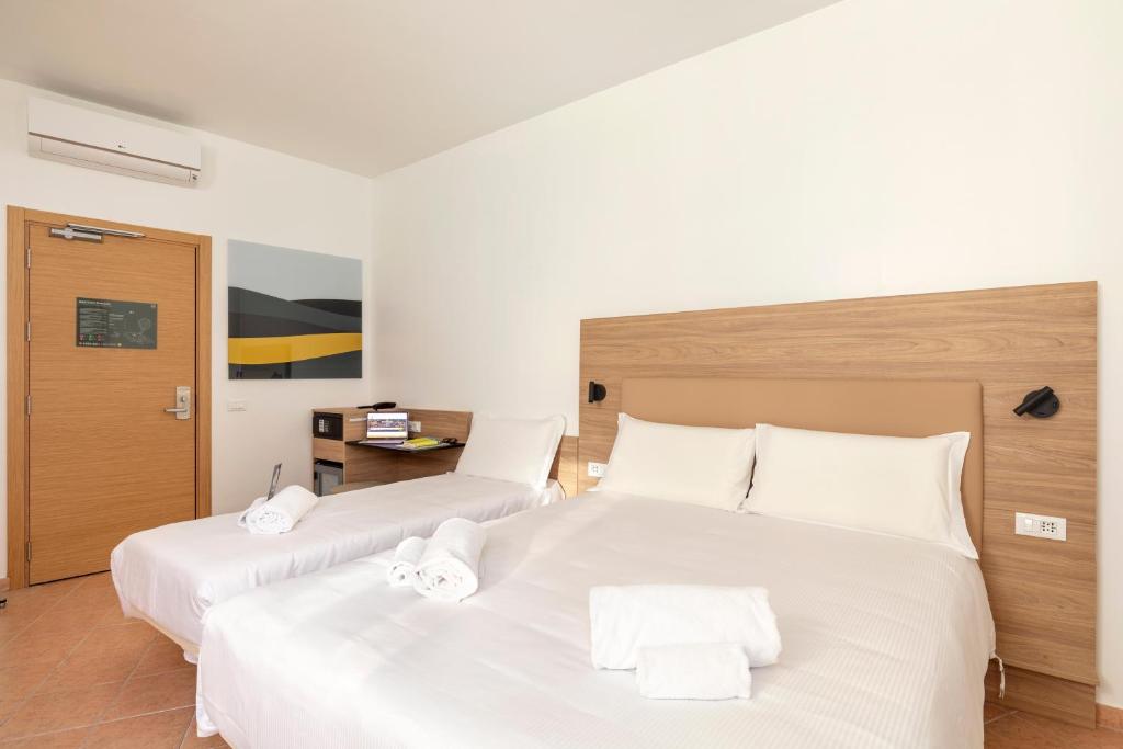 Postel nebo postele na pokoji v ubytování B&B Hotel Pomezia Roma